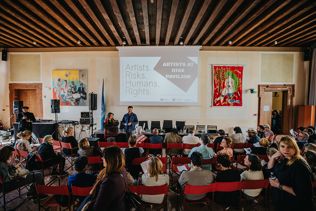 Marita Mukkonnen and Ivor Stodolsky, co-founders and co-directors of Artists at Risk (AR), welcome guests to the AR-Pavilion in Venice,  at UNESCO's Palazzo Zorzi.