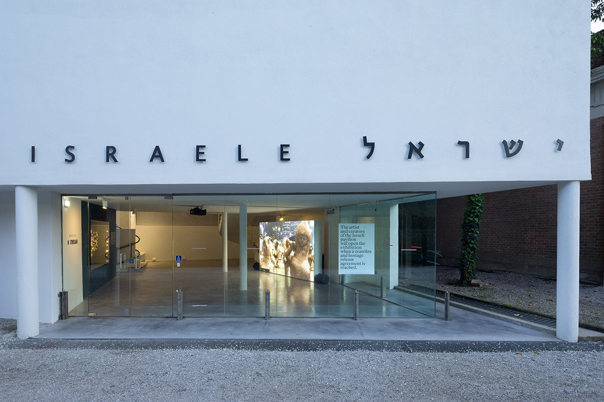 A sign placed by the artists and curators of the Israel Pavilion at its closed entrance, street view, The Israel Pavilion  at the 60th International Art Exhibition La Biennale di Venezia, 2024. Image: Tal Nisim.